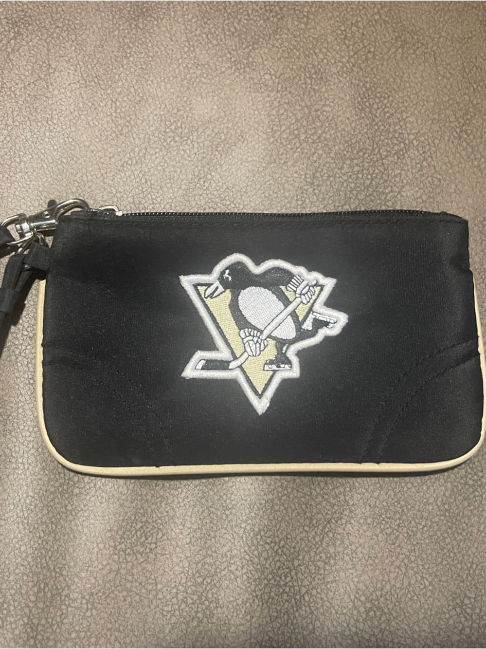 Little Earth Black Wristlet with Cream Trim and Emblem